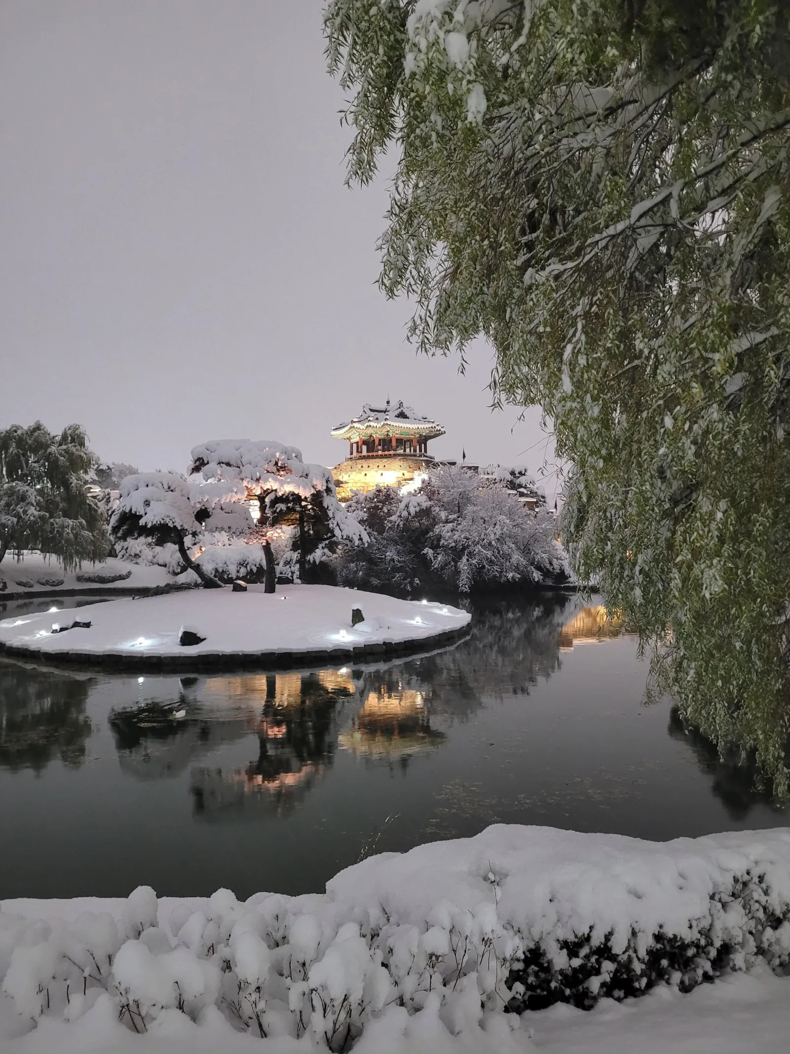 Snow on the fortress pond and pavilion at Hwaseong in winter