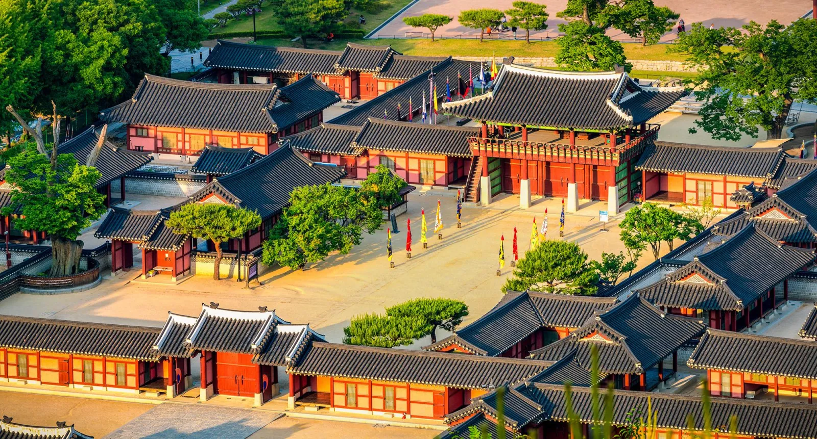 Thatched and tiled Joseon-era houses along a lane in the Korean Folk Village