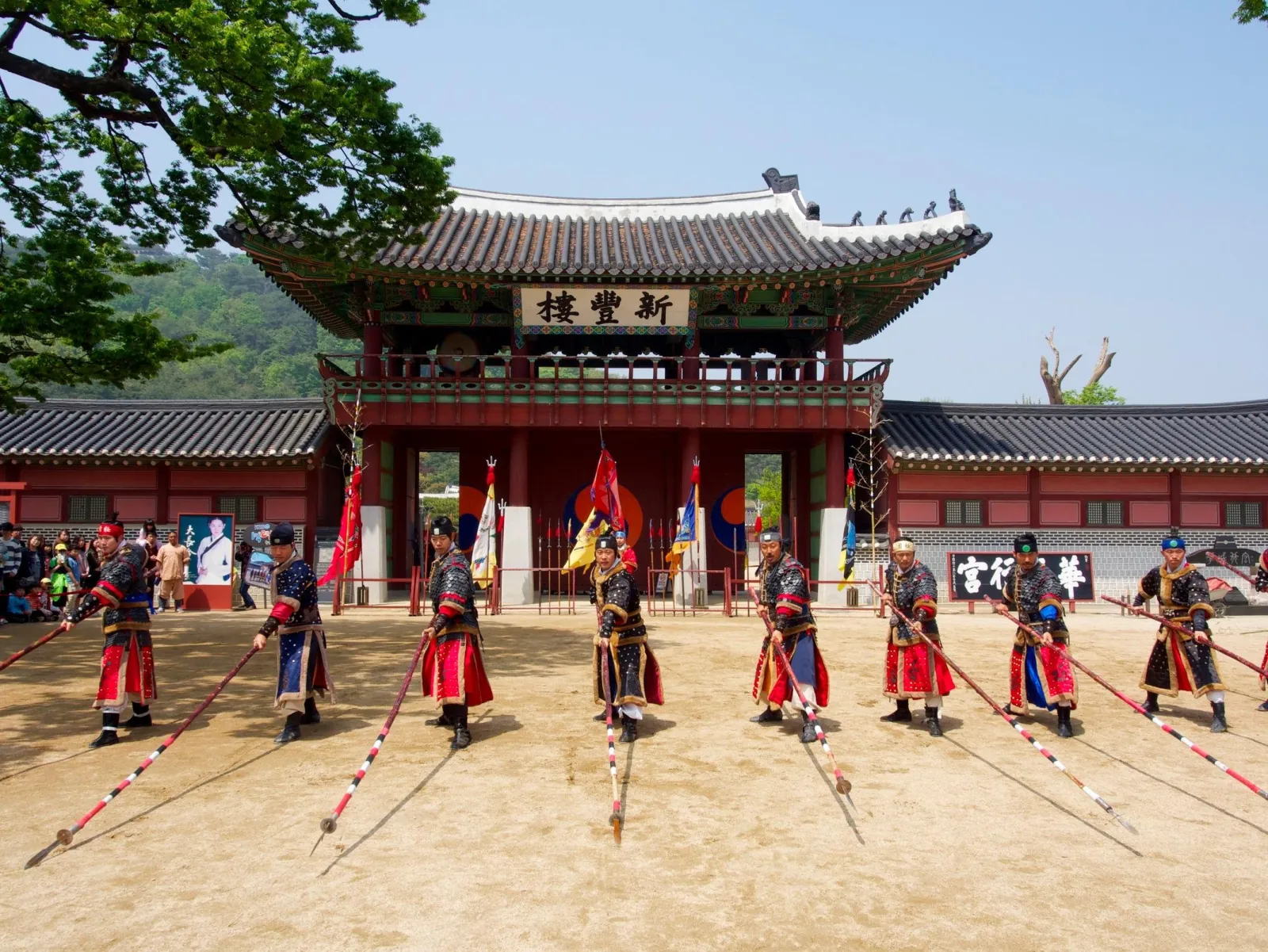 Guards in Joseon-era uniform performing the martial arts display outside Hwaseong Haenggung Palace